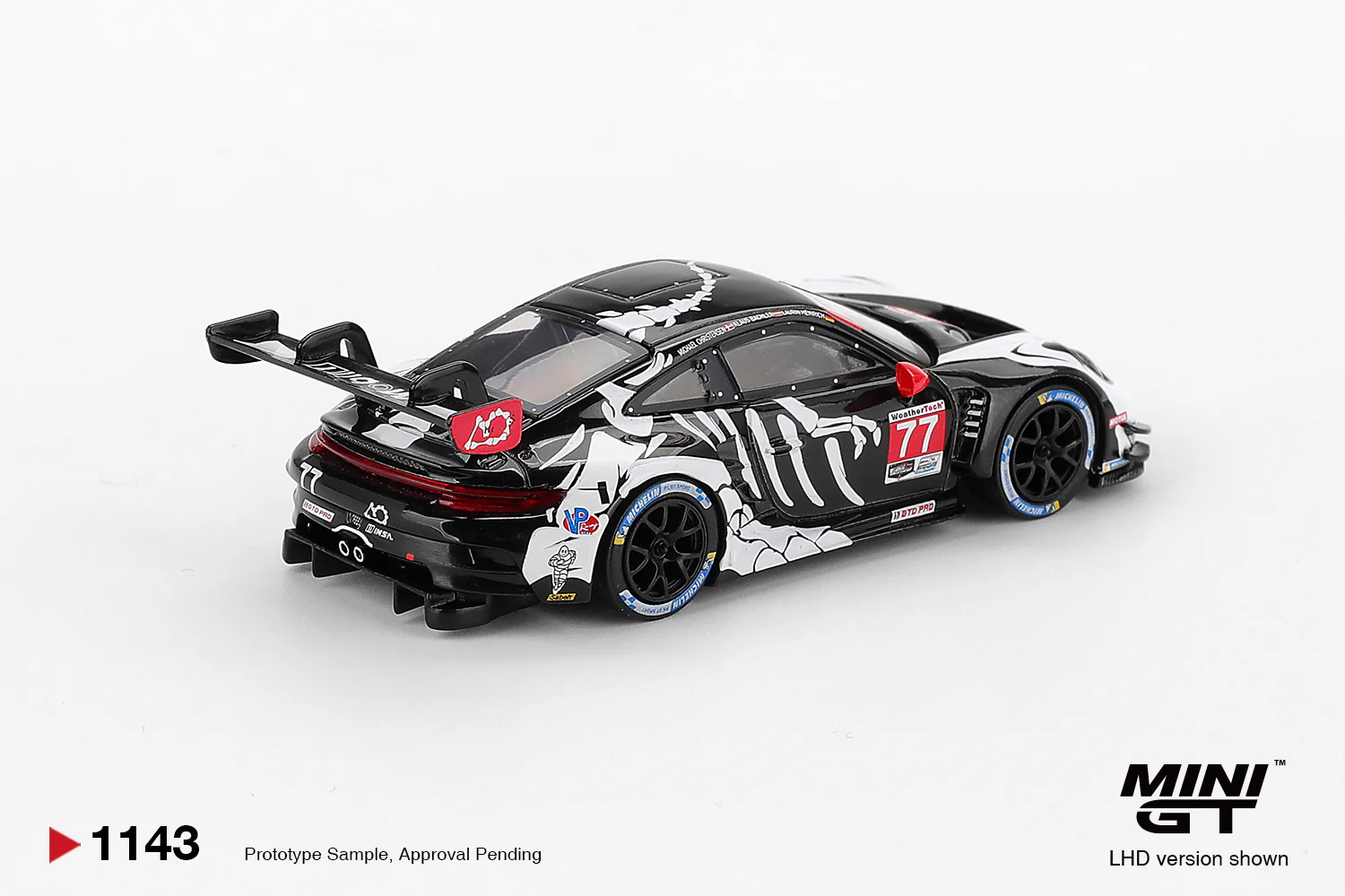 Mini GT - "Skeleton Rexy" Porsche 911 GT3 R #77 AO Racing 2025 IMSA  Petit Le Mans - Scala 1/64 MGT01143-L - Image 2