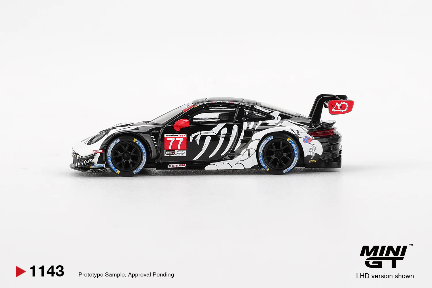 Mini GT - "Skeleton Rexy" Porsche 911 GT3 R #77 AO Racing 2025 IMSA  Petit Le Mans - Scala 1/64 MGT01143-L - Image 3